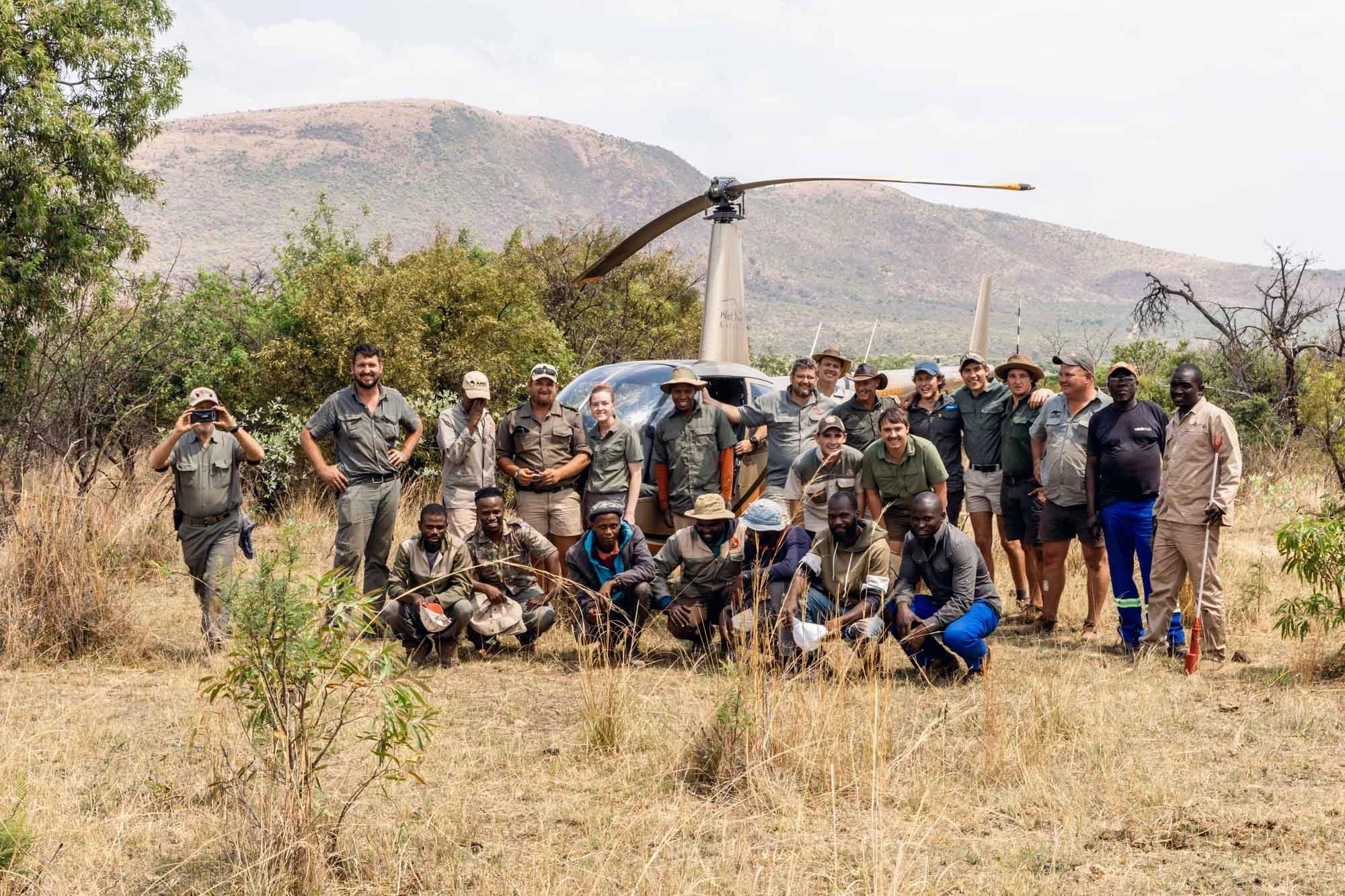Conservation team with helicopter